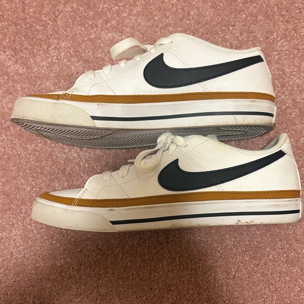 Nike White and Black Sneakers with Gold Accents